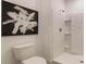 Modern bathroom featuring a sleek toilet and a convenient walk-in shower at 1300 Isleta Loop, Kissimmee, FL 34741