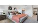 Bright bedroom with neutral tones, stylish bedding, and tasteful decor at 1300 Isleta Loop, Kissimmee, FL 34741