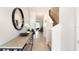 Bright entryway features stylish console table with a mirror and staircase leading to the upper level at 1300 Isleta Loop, Kissimmee, FL 34741
