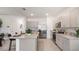 Bright kitchen featuring stainless steel appliances, granite countertops, and a large island at 1300 Isleta Loop, Kissimmee, FL 34741