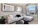 Comfortable living room with a sectional sofa, stylish accent tables, and natural light at 1300 Isleta Loop, Kissimmee, FL 34741