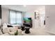 Living room with comfortable seating, entertainment center, and neutral tones at 1300 Isleta Loop, Kissimmee, FL 34741