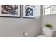 Powder room featuring neutral paint color and modern abstract wall art at 1300 Isleta Loop, Kissimmee, FL 34741