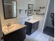Modern bathroom featuring double vanities, updated fixtures, and tile flooring at 1321 Carey Glen Cir, Orlando, FL 32824
