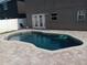 Inviting backyard pool featuring a paved patio area, perfect for relaxation and outdoor entertaining at 1321 Carey Glen Cir, Orlando, FL 32824