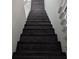 Dark wood staircase leading to the second floor of the home at 1321 Carey Glen Cir, Orlando, FL 32824