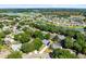 Expansive aerial view of the neighborhood showcasing the homes, trees, and picturesque lakes in the area at 1324 Saddleridge Dr, Orlando, FL 32835