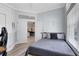 Comfortable bedroom featuring wood-look floors and a view into the hallway and other parts of the home at 1324 Saddleridge Dr, Orlando, FL 32835
