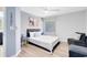 Stylishly decorated bedroom with a modern ceiling fan, soothing wall art, and comfortable furnishings at 1324 Saddleridge Dr, Orlando, FL 32835