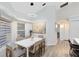 Elegant dining room with modern chandelier, large window, and stylish decor at 1324 Saddleridge Dr, Orlando, FL 32835