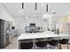 Modern kitchen with stainless steel appliances, a large island, pendant lighting, and plenty of cabinet space at 1324 Saddleridge Dr, Orlando, FL 32835