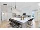 Open kitchen featuring a large island with seating and modern pendant lighting at 1324 Saddleridge Dr, Orlando, FL 32835