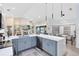 Bright, open kitchen features modern appliances, an island with seating, and transitions into the dining and living areas at 1324 Saddleridge Dr, Orlando, FL 32835