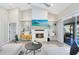 Cozy living room with a modern fireplace, comfortable seating, and bright natural light at 1324 Saddleridge Dr, Orlando, FL 32835