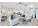 Bright living room with comfortable sectional sofa and seamless transition to the kitchen area at 1324 Saddleridge Dr, Orlando, FL 32835