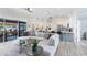 Spacious living room with large sectional sofa, modern decor, and open access to kitchen at 1324 Saddleridge Dr, Orlando, FL 32835