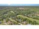 Overhead view of a home surrounded by a golf course and lush greenery at 1333 Killbricken Cir, Ormond Beach, FL 32174