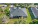Aerial view of the house featuring a screened lanai and well-maintained roof at 1333 Killbricken Cir, Ormond Beach, FL 32174