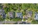 Aerial view of the house with a gray roof and surrounding trees and properties at 1333 Killbricken Cir, Ormond Beach, FL 32174
