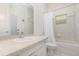 Bright bathroom with a shower-tub combo, toilet, and vanity with a mirror at 1333 Killbricken Cir, Ormond Beach, FL 32174