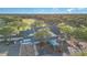 Aerial view of community clubhouse with covered entrance and surrounding trees and landscaping at 1333 Killbricken Cir, Ormond Beach, FL 32174