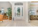 Bright entryway featuring tile floors, transom windows, and a clear view into the rest of the home at 1333 Killbricken Cir, Ormond Beach, FL 32174