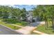 Single-story home with mature trees, long driveway, and well-kept lawn at 1333 Killbricken Cir, Ormond Beach, FL 32174