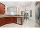 Bright kitchen showcasing stainless steel appliances, including a modern dishwasher, and cozy breakfast area with an outdoor view at 1333 Killbricken Cir, Ormond Beach, FL 32174