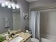 Bathroom featuring granite vanity and shower with bathtub at 14400 Saint Georges Hill Dr, Orlando, FL 32828