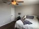 Cozy bedroom featuring a ceiling fan and wood floors at 14400 Saint Georges Hill Dr, Orlando, FL 32828