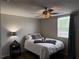 Cozy bedroom featuring a ceiling fan and wood floors at 14400 Saint Georges Hill Dr, Orlando, FL 32828