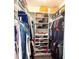 Organized walk-in closet featuring shelving and hanging storage, maximizing space for clothing and accessories at 14400 Saint Georges Hill Dr, Orlando, FL 32828