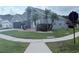Charming two-story home with landscaped yard and attached two-car garage at 14400 Saint Georges Hill Dr, Orlando, FL 32828