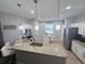 Bright kitchen with granite counters, stainless appliances, and pendant lighting at 14400 Saint Georges Hill Dr, Orlando, FL 32828