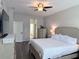 Bright and spacious main bedroom with modern décor, hard floors, and an ensuite bathroom for added convenience at 14400 Saint Georges Hill Dr, Orlando, FL 32828
