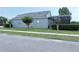 Beautiful home with manicured lawn and mature trees with a screened-in patio at 14400 Saint Georges Hill Dr, Orlando, FL 32828