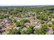 An aerial view shows a residential neighborhood with tree-lined streets and well-kept properties at 1491 Granada Ave, Daytona Beach, FL 32117