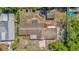 Overhead view of property highlighting the roof, backyard, and surrounding vegetation at 1491 Granada Ave, Daytona Beach, FL 32117