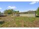 The exterior features a backyard, a patio, a fenced-in yard, and a well-manicured lawn at 1491 Granada Ave, Daytona Beach, FL 32117