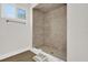 Tile shower and floor, bright window, and a modern design at 1491 Granada Ave, Daytona Beach, FL 32117