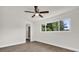 Bright bedroom with a window offering an outdoor view, and wood-look flooring at 1491 Granada Ave, Daytona Beach, FL 32117