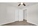 Clean bedroom with wood-look flooring, closet, and view of an open doorway at 1491 Granada Ave, Daytona Beach, FL 32117