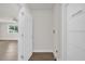 Hallway view showcasing the home's neutral paint and modern flooring at 1491 Granada Ave, Daytona Beach, FL 32117