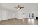 Bright and airy living room with new laminate flooring and french doors at 1491 Granada Ave, Daytona Beach, FL 32117