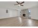 Large open-concept living room with brick fireplace and lots of natural light at 1491 Granada Ave, Daytona Beach, FL 32117