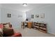 Functional home office with desk, shelving, and comfortable seating, perfect for remote work or study at 1553 Caterpillar St, St Cloud, FL 34771