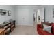 Spacious home office with closet and a comfy sofa, ideal for work and relaxation at 1553 Caterpillar St, St Cloud, FL 34771