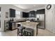 Modern kitchen featuring granite countertops and stainless steel appliances at 1553 Caterpillar St, St Cloud, FL 34771