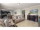 Bright living room flowing into the kitchen, perfect for entertaining and relaxation at 1553 Caterpillar St, St Cloud, FL 34771