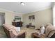 Cozy living room featuring comfortable seating and a decorative fireplace at 1553 Caterpillar St, St Cloud, FL 34771